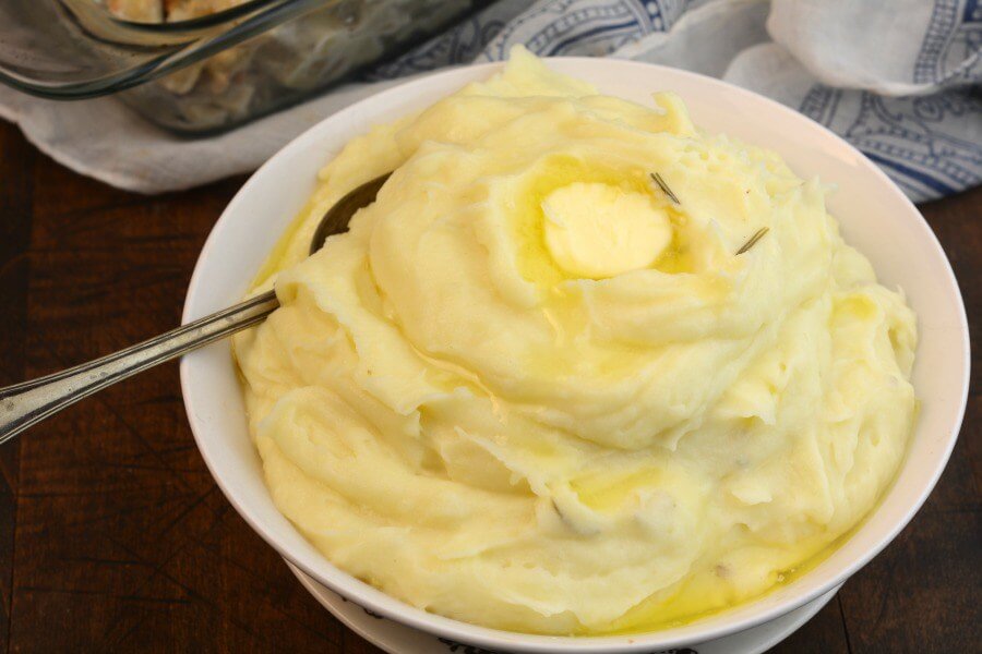 Healthy Instant Pot Recipes: Mashed Potatoes and dallop of butter in white dish